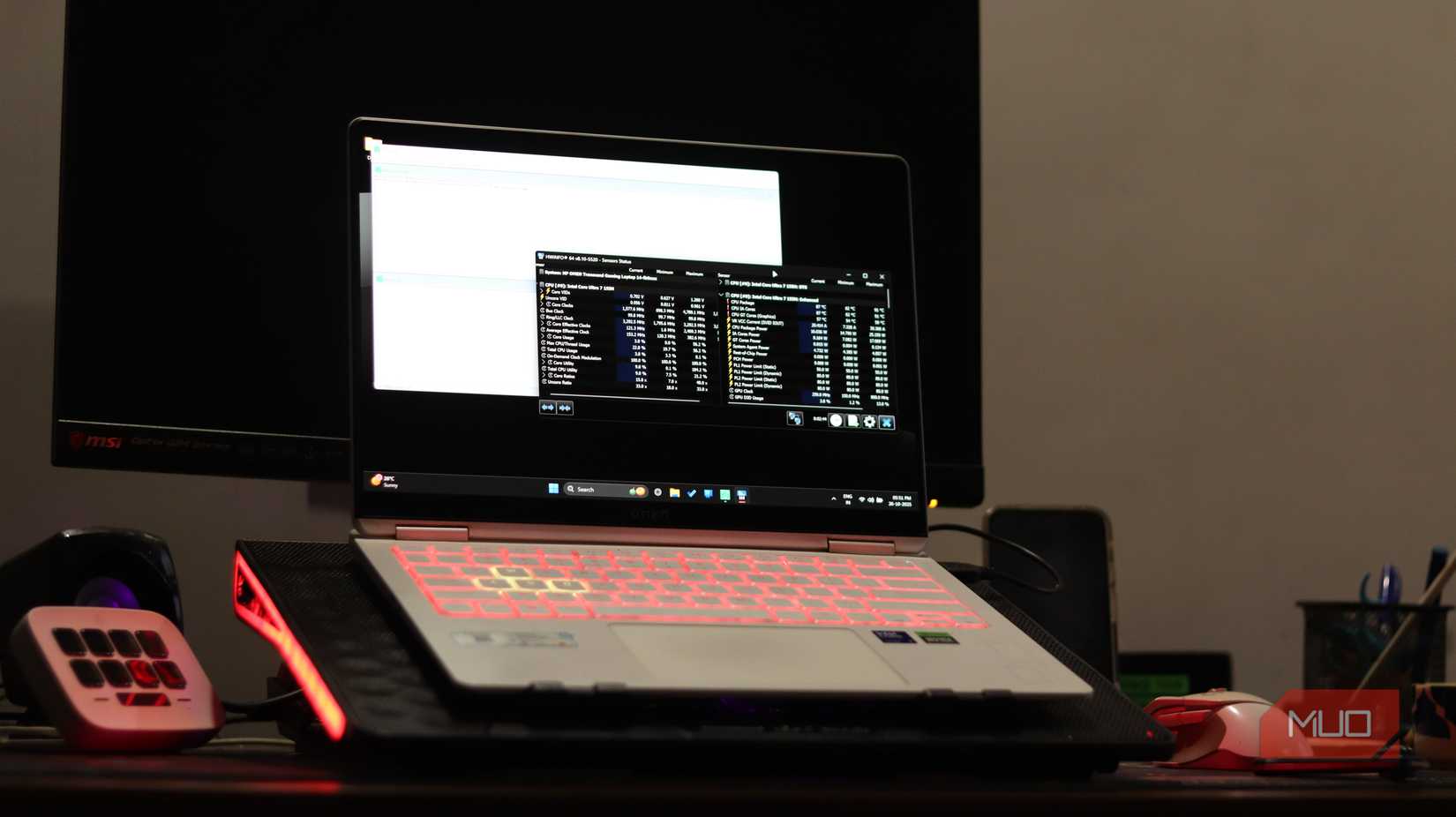 Front view of gaming laptop on cooling pad.