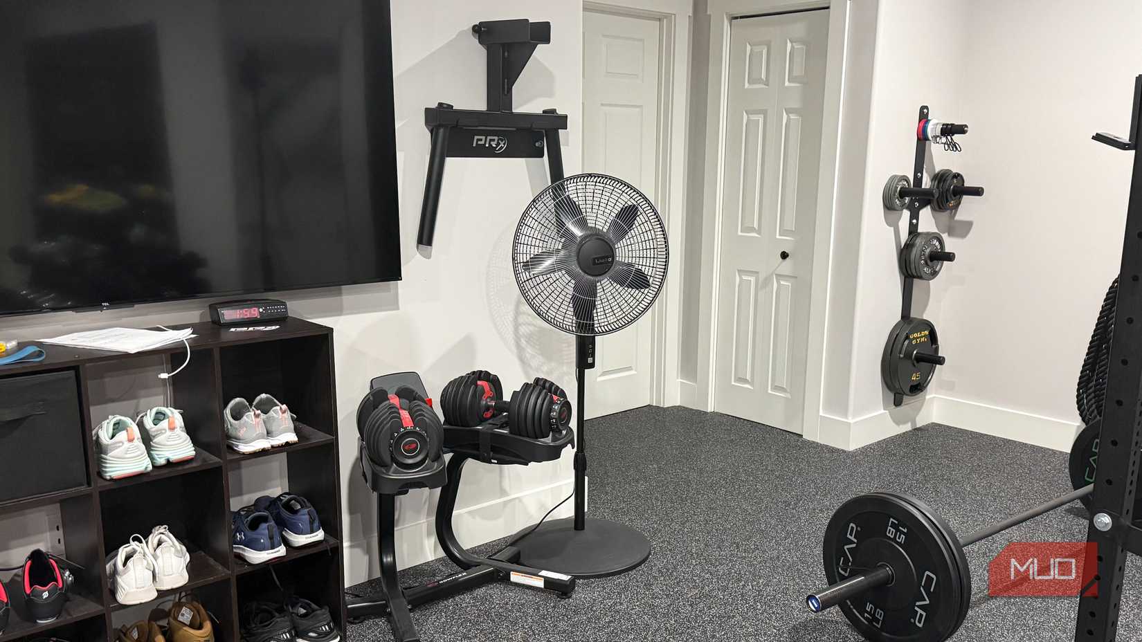 gym fan next to weights 