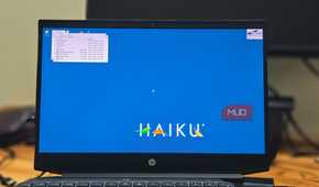 Haiku OS running on a HP pavillion gaming laptop kept on a wooden table