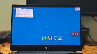 Haiku OS running on a HP pavillion gaming laptop kept on a wooden table