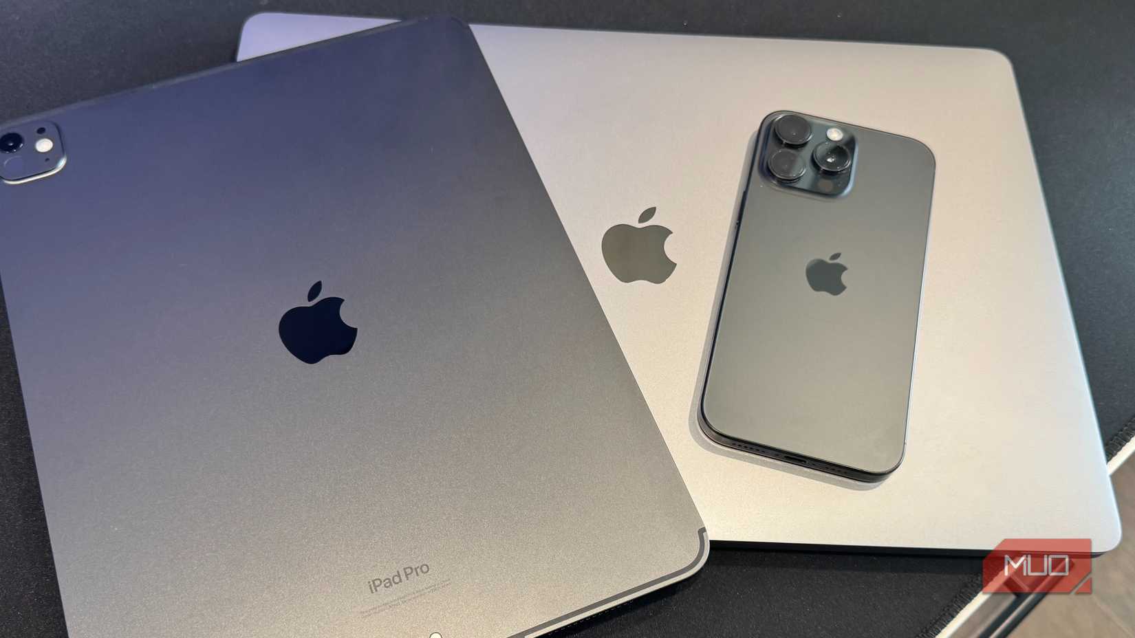 ipad pro macbook pro and iphone 15 pro max stacked on top