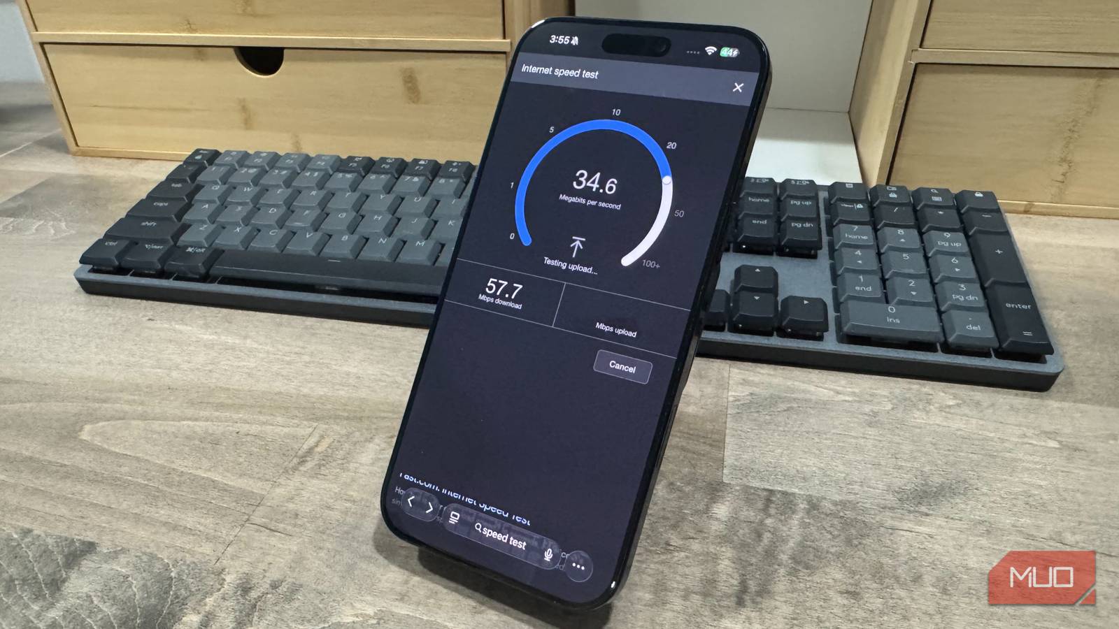 iphone 15 pro max on desk with speed test loaded