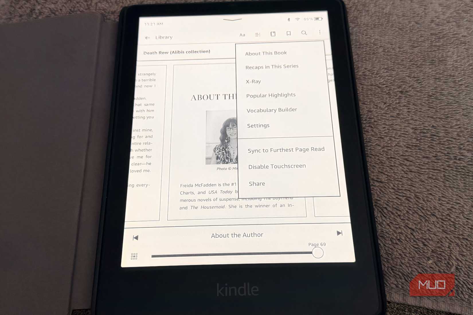 An Amazon Kindle showing the location for activating the X-Ray feature.