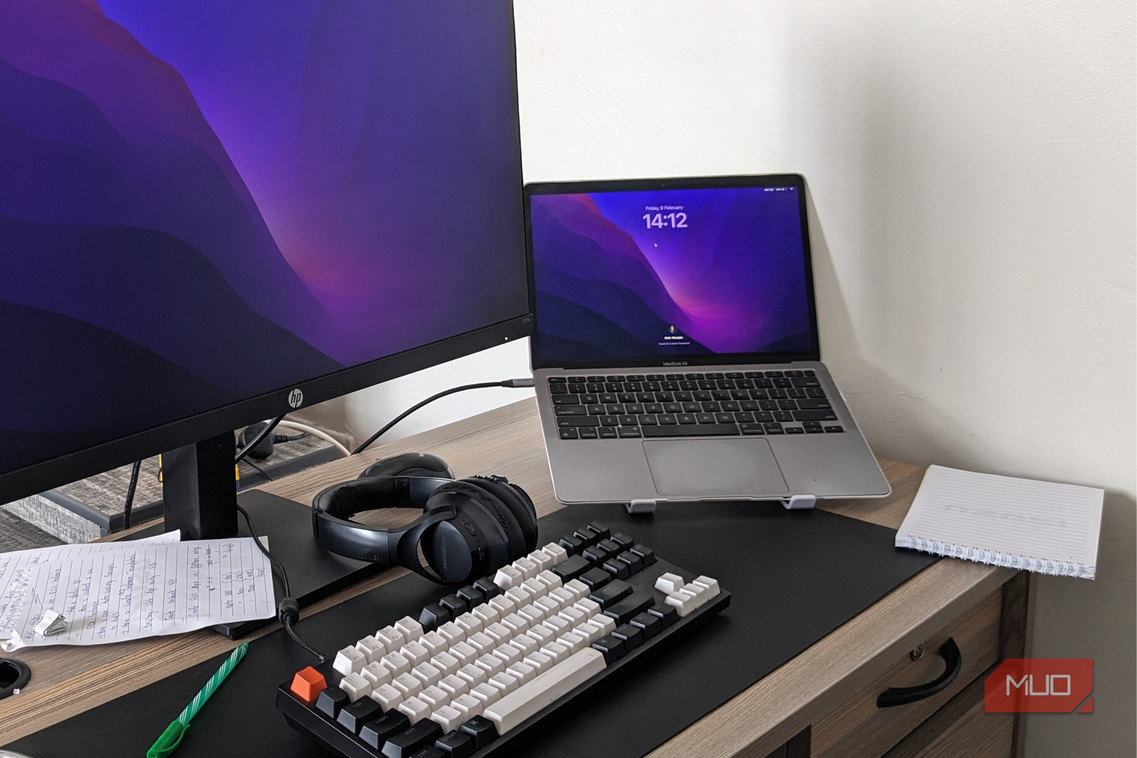 MacBook Air on a stand connected to a monitor