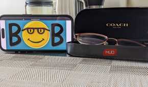 Microsoft Bob Logo on Phone Next to Glasses Case
