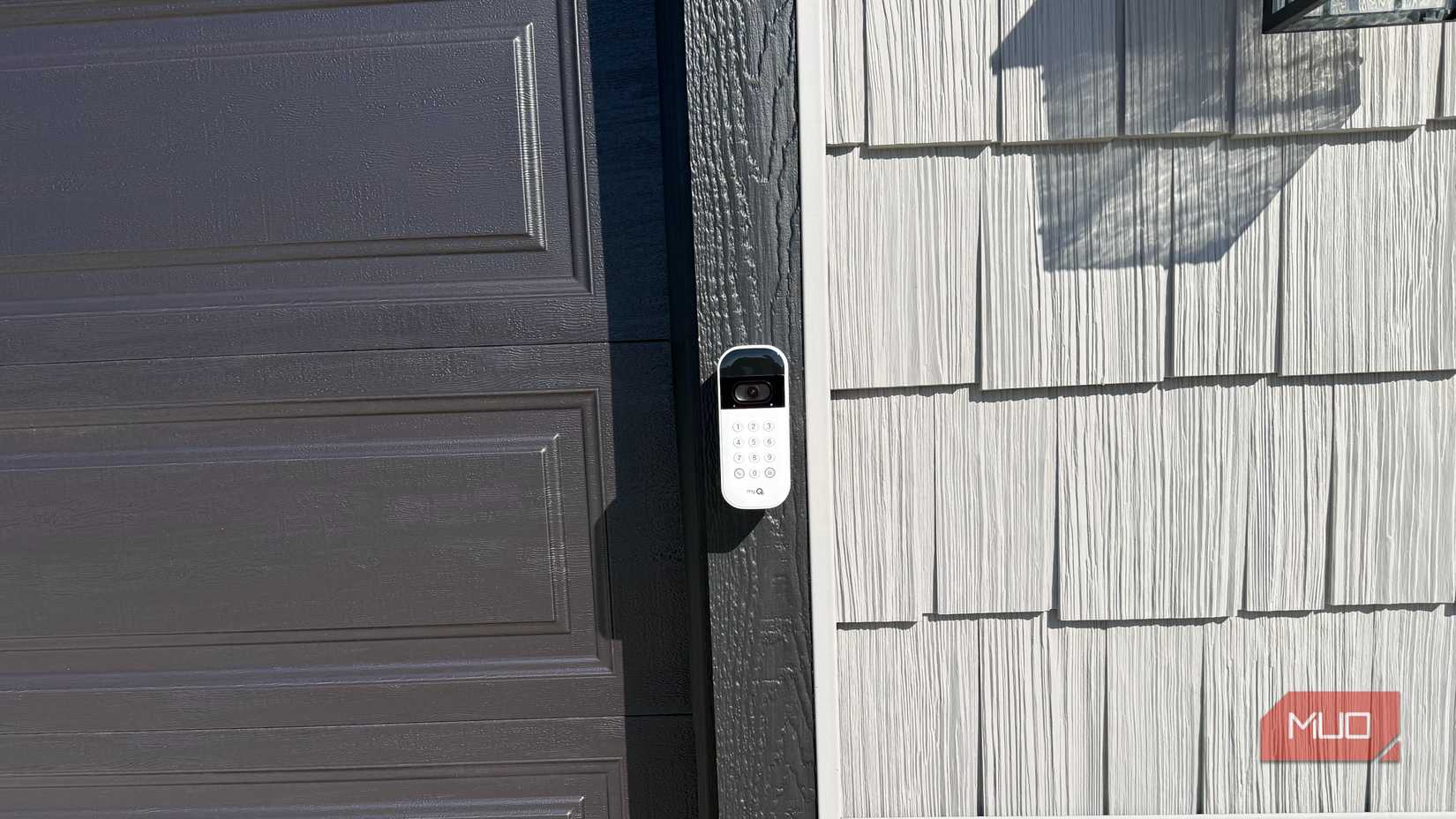 myq garage video keypad mounted on garage straight