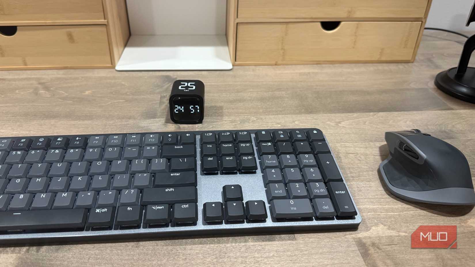pomodoro cube timer on desk with keyboard and mouse