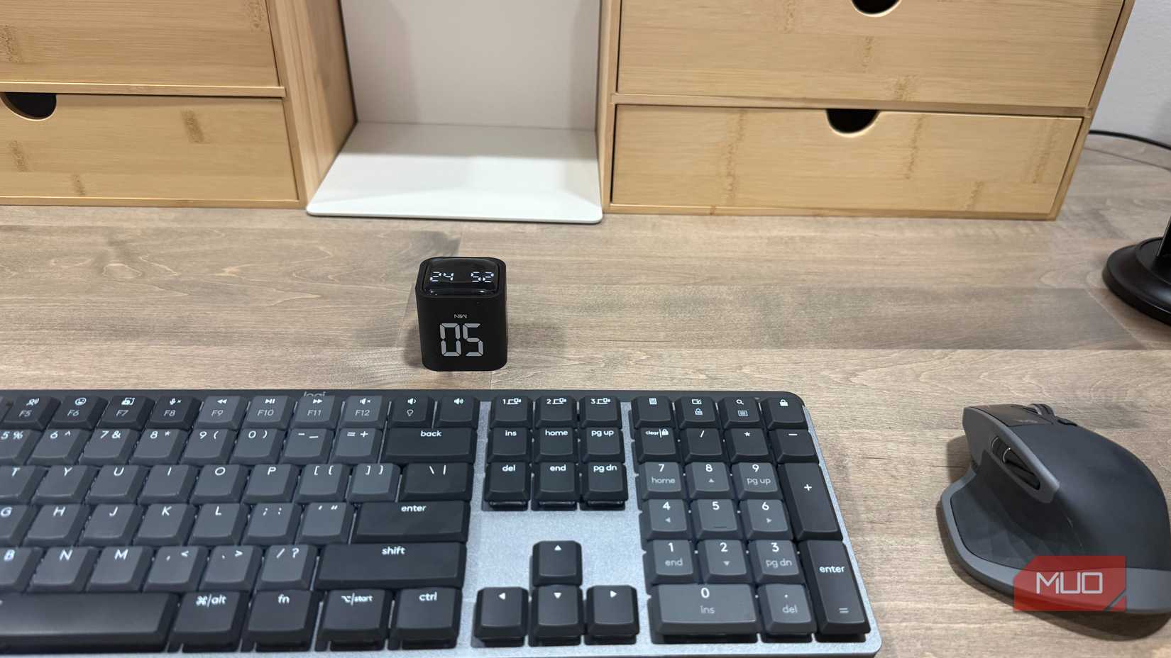pomodoro timer cube on desk with keyboard and mouse