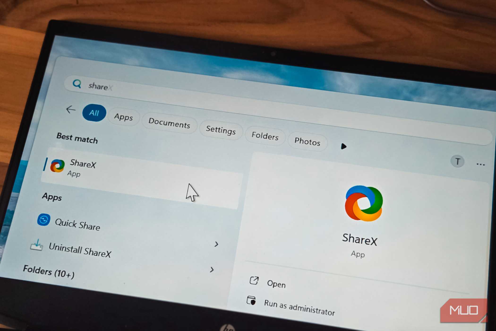 ShareX app logo open on a laptop screen kept on a table