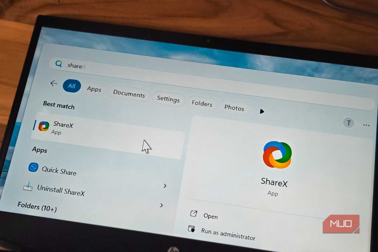 ShareX app logo open on a laptop screen kept on a table
