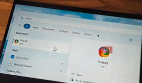 ShareX app logo open on a laptop screen kept on a table