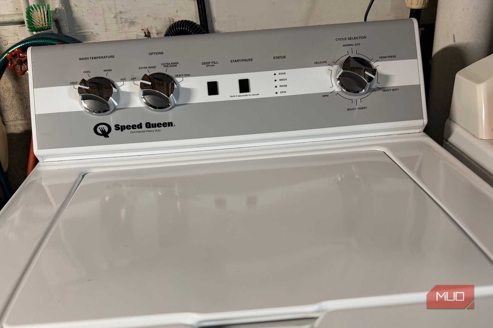 The top of a washing machine in a home. 