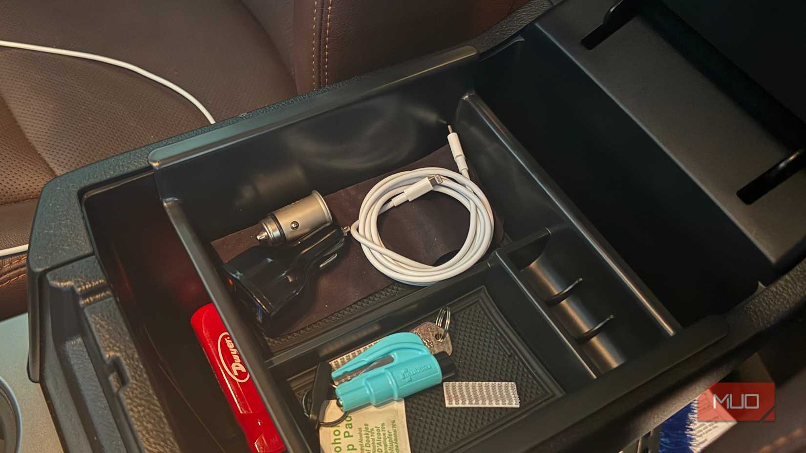 white usbc lightning cable coiled in car center console