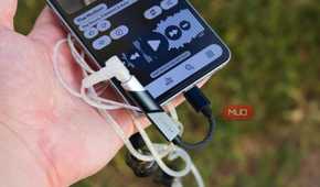 The Fiio KA11 DAC plugged into a Galaxy S25 Edge.