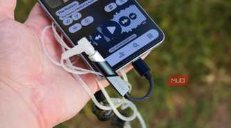 The Fiio KA11 DAC plugged into a Galaxy S25 Edge.