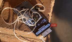 A USB-C DAC and headphones connected to a Galaxy S25 Edge.