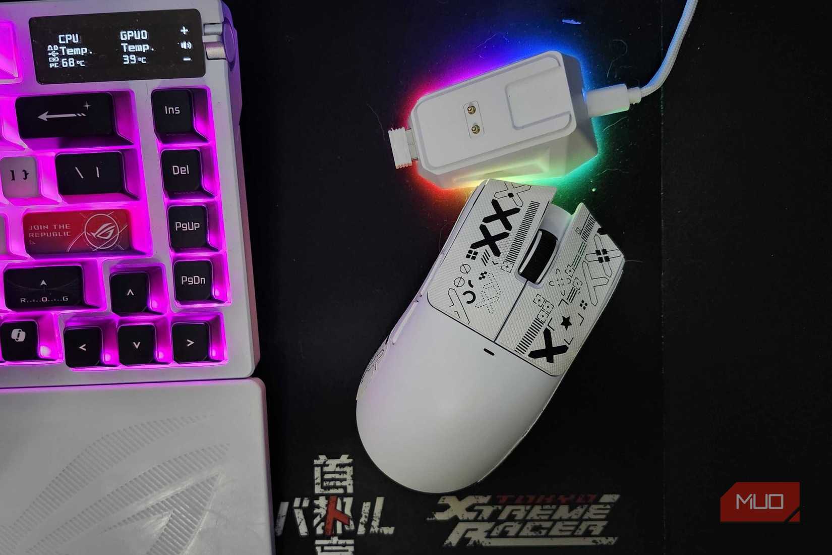 Attack Shark X11 mouse and charging dock, resting on a Tokyo Xtreme Racer mousepad