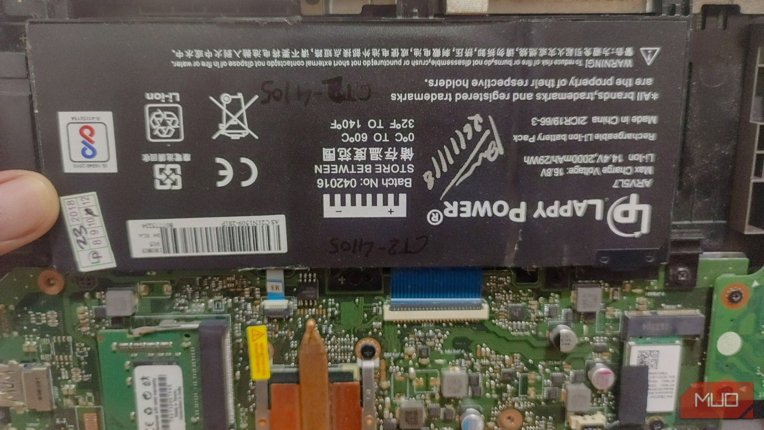 battery-attached-to-laptop-motherboard