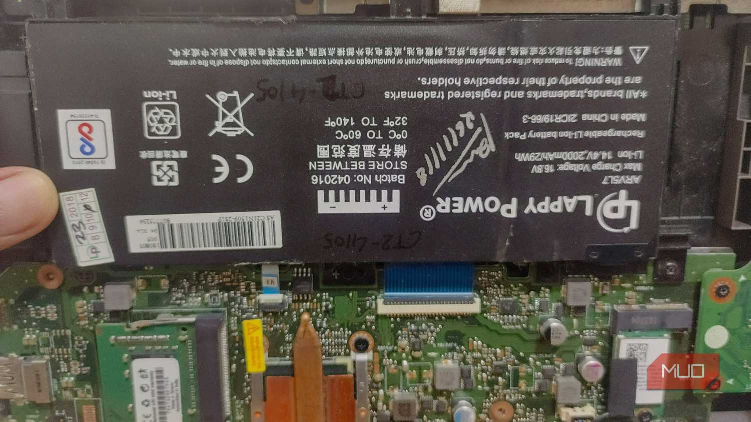 battery-attached-to-laptop-motherboard
