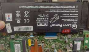 battery-attached-to-laptop-motherboard