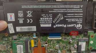 battery-attached-to-laptop-motherboard