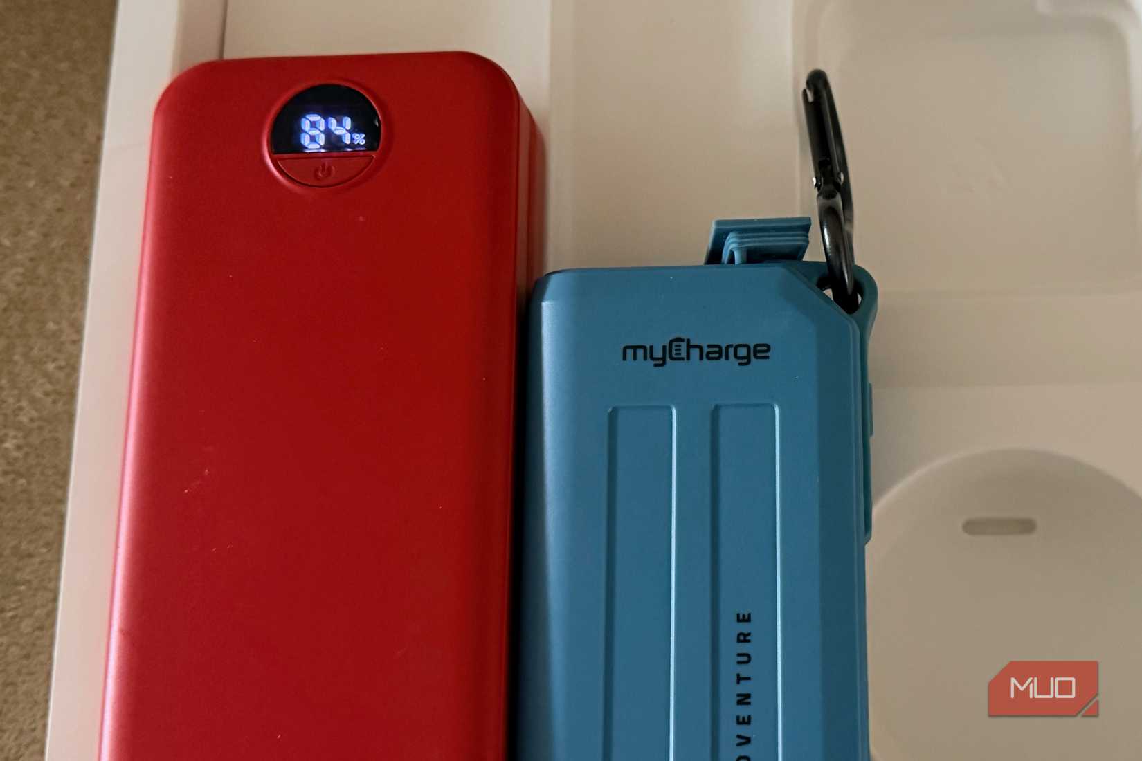 Mobile device chargers in a MacBook Pro box.