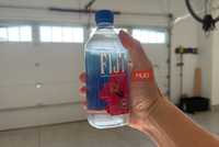 fiji water bottle in hand