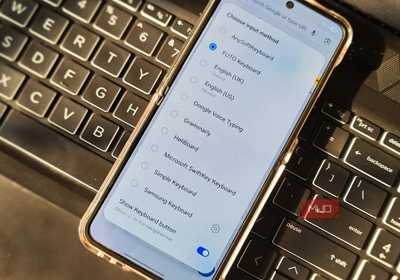 Default keyboard settings open in Samsung Galaxy Z Flip 6 kept on a laptop keyboard 
