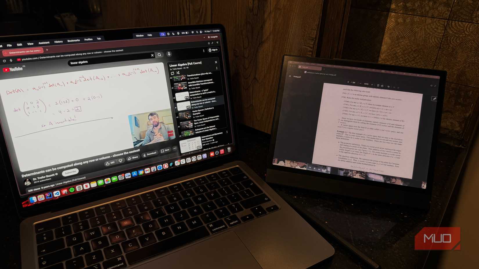 Linear Algebra YouTube video on laptop and notes on e reader