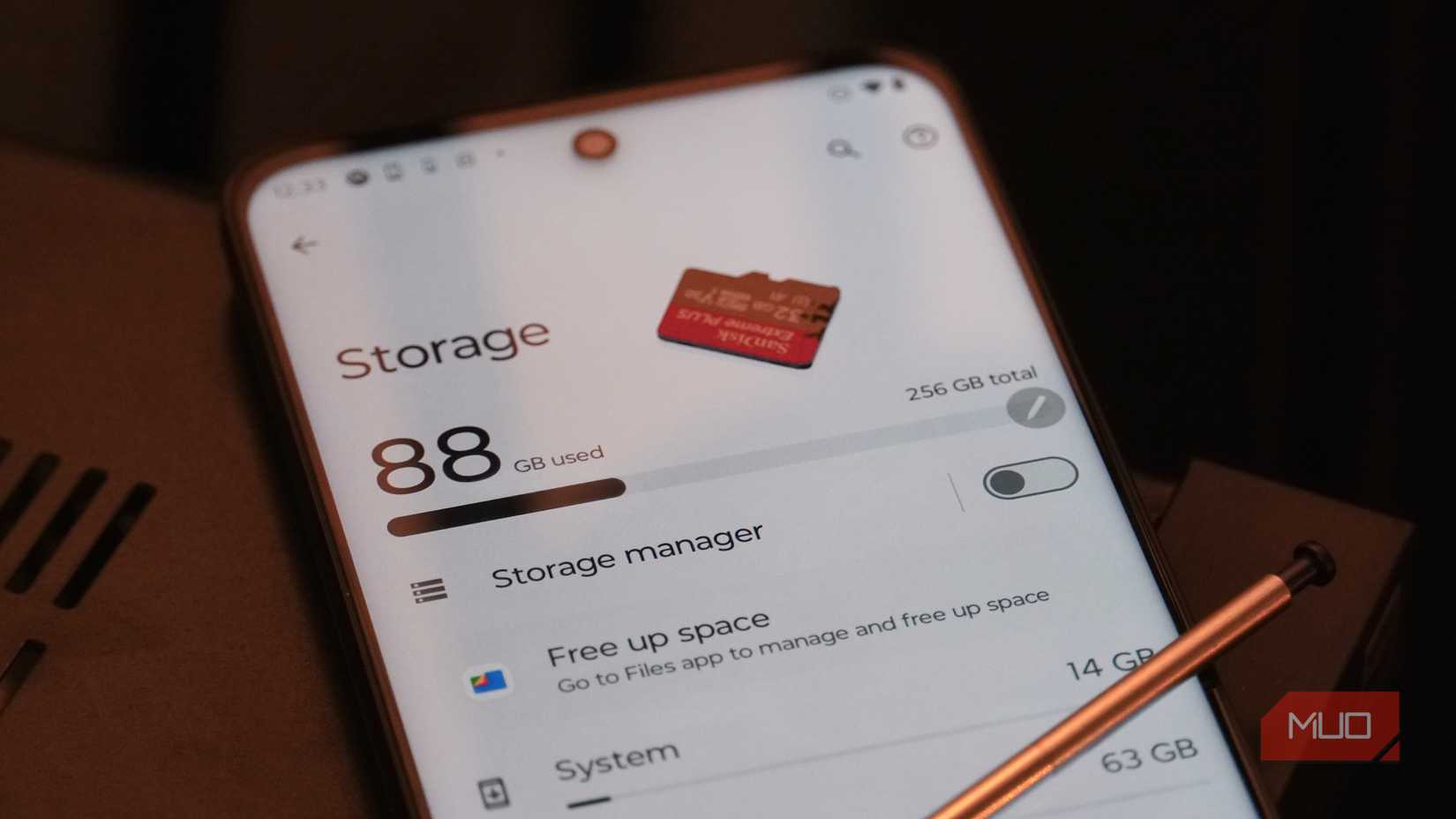A microSD card lying atop a Moto G Stylus 5G 2023 screen.