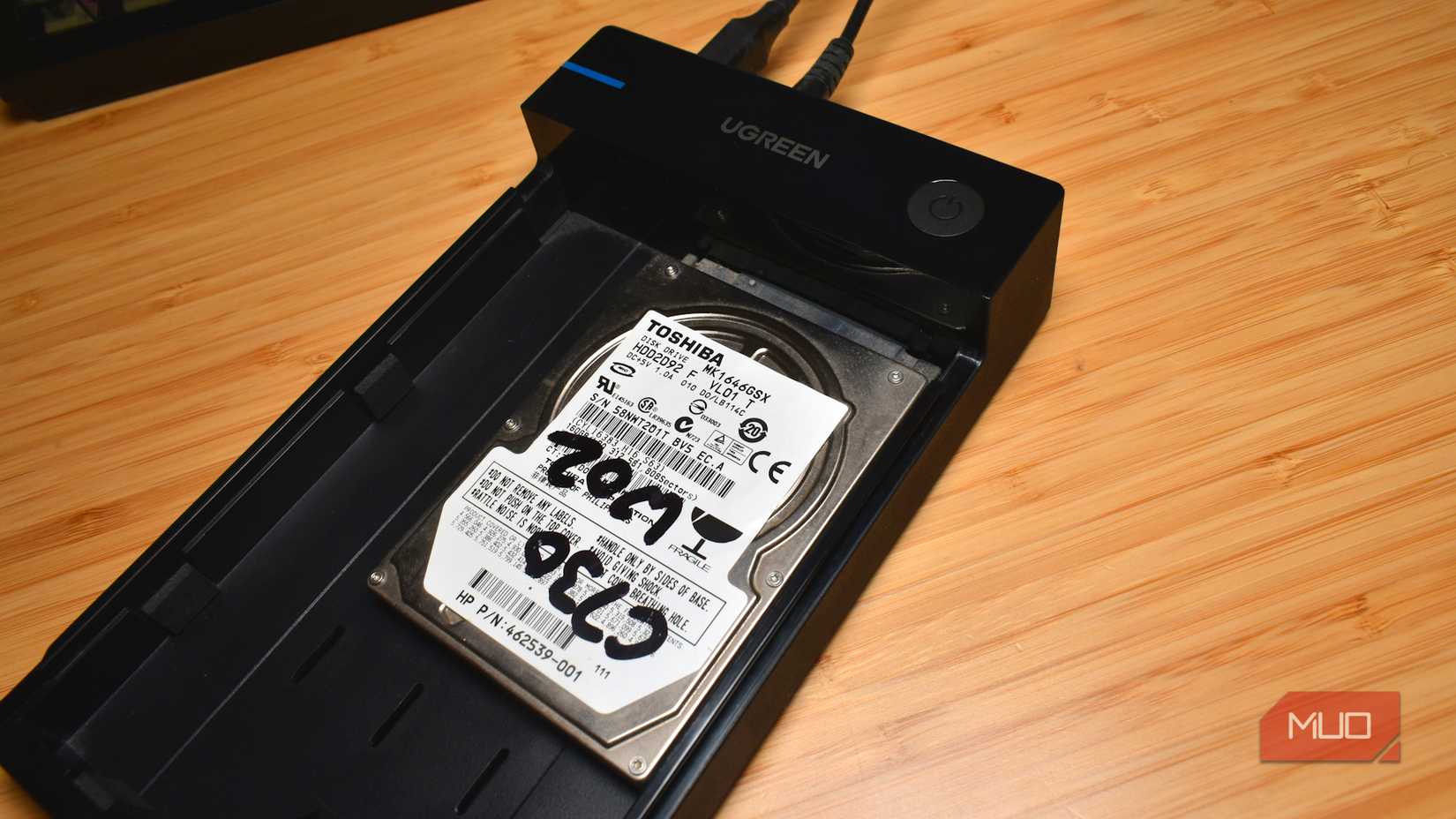 old hard drive plugged into reader.