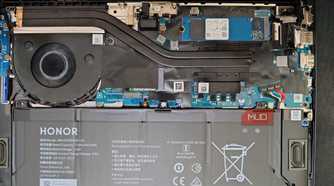 Open laptop back with motherboard and battery visible