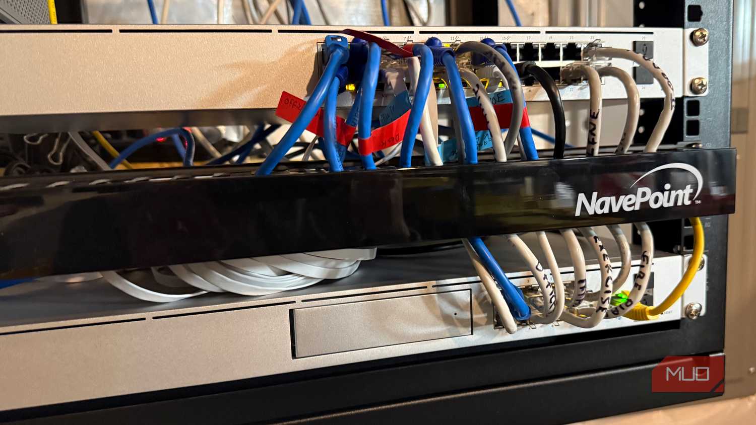 Serveral ethernet cables routed through organizer