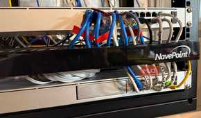 Serveral ethernet cables routed through organizer