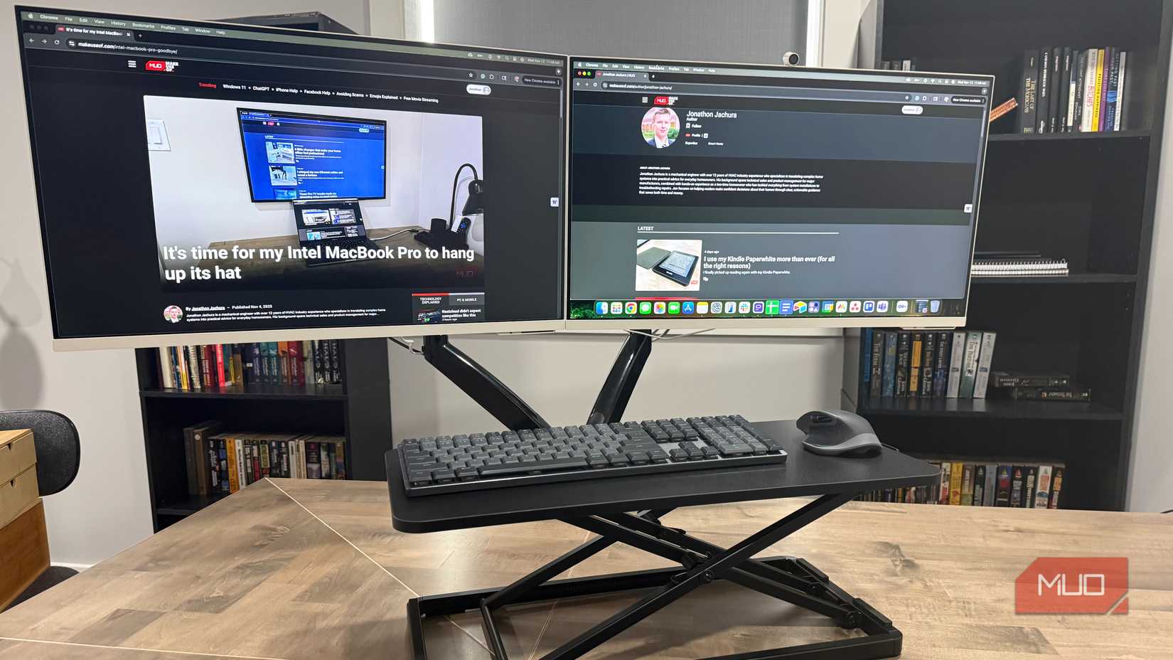 two samsung monitors with keyboard riser tray