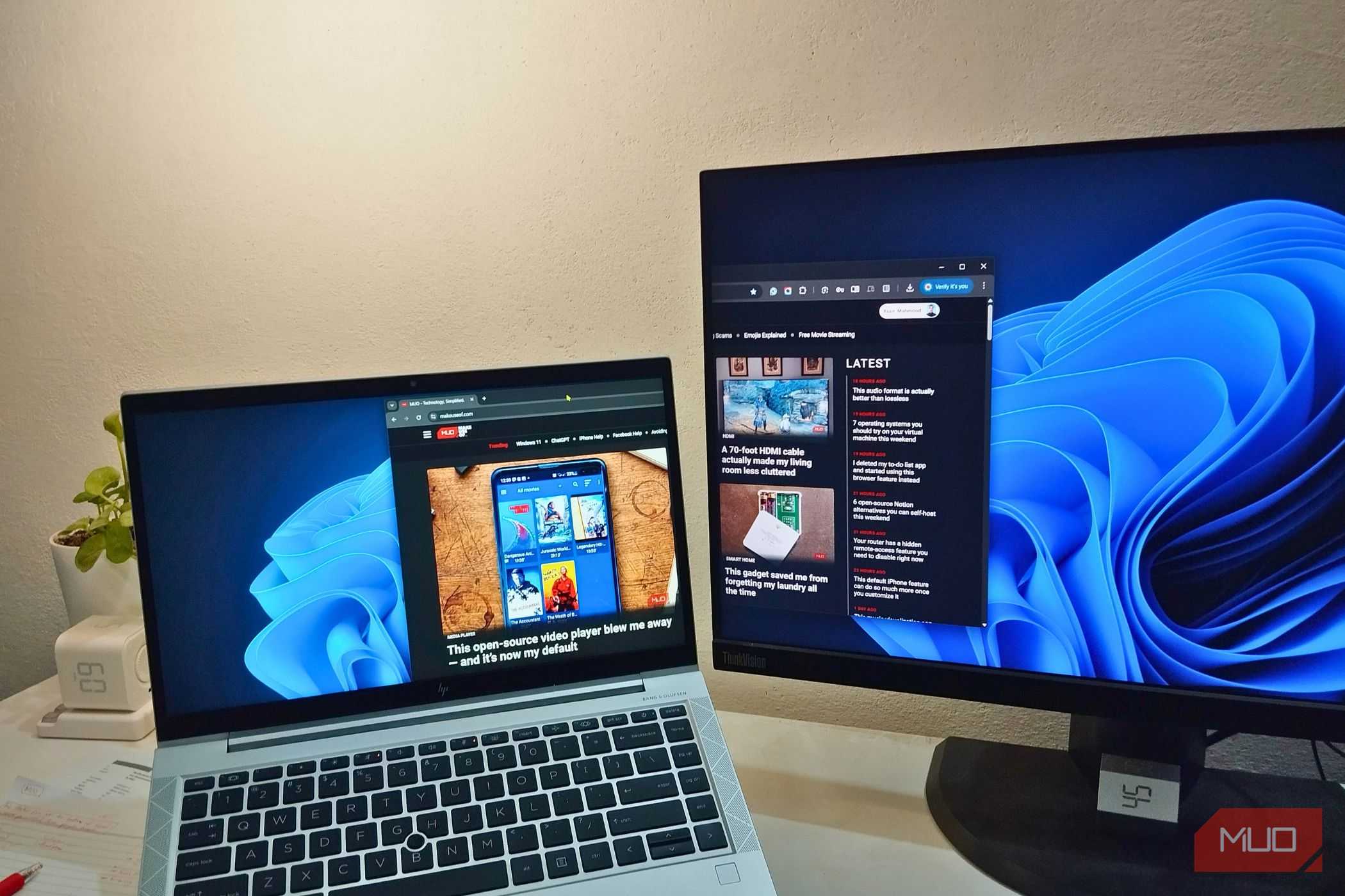 A monitor using a laptop as an extended display though Spacedesk showing MUO website.