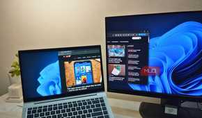 A monitor using a laptop as an extended display though Spacedesk showing MUO website.