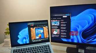 A monitor using a laptop as an extended display though Spacedesk showing MUO website.