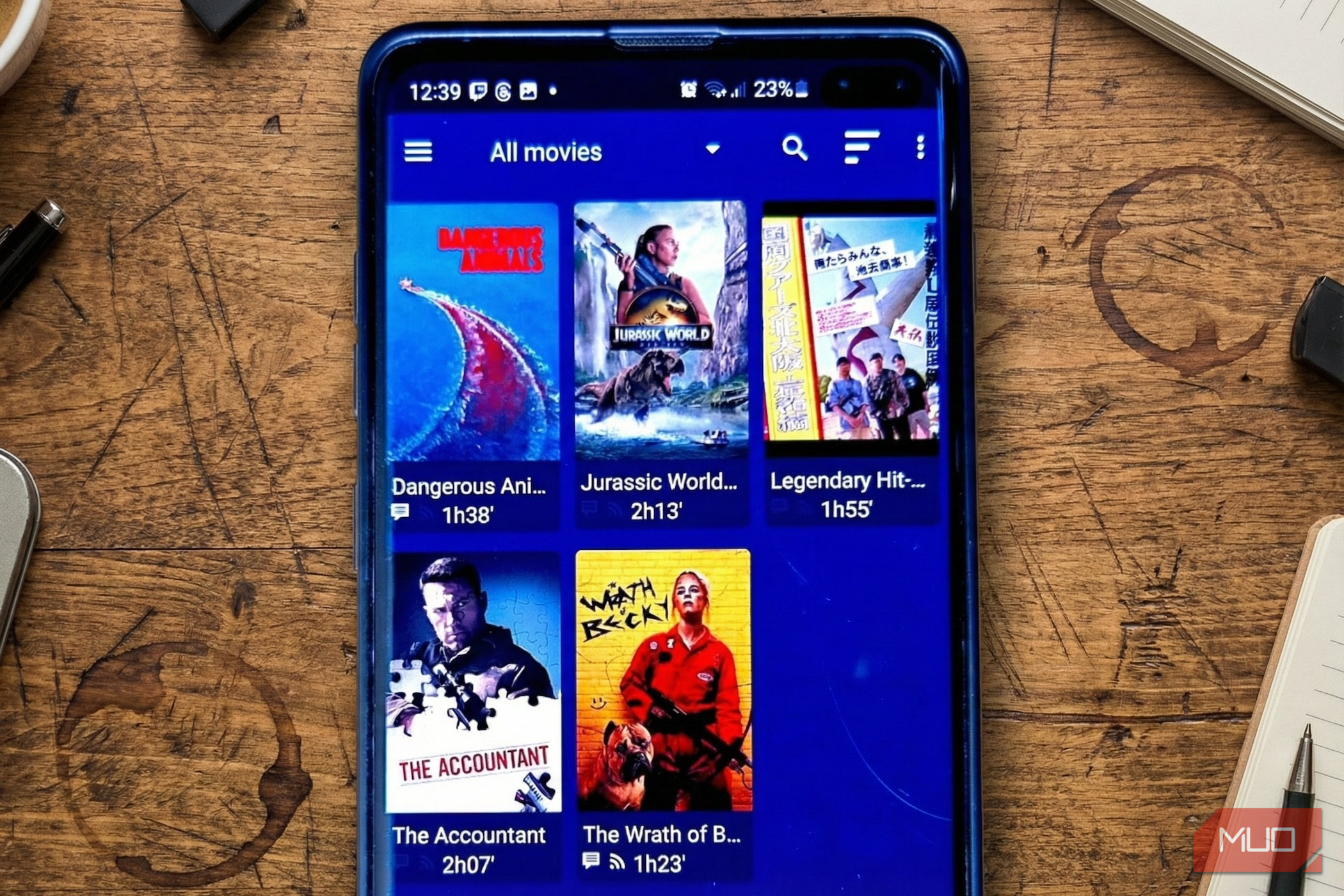 A smartphone displaying the Nova Video Player movie library grid.