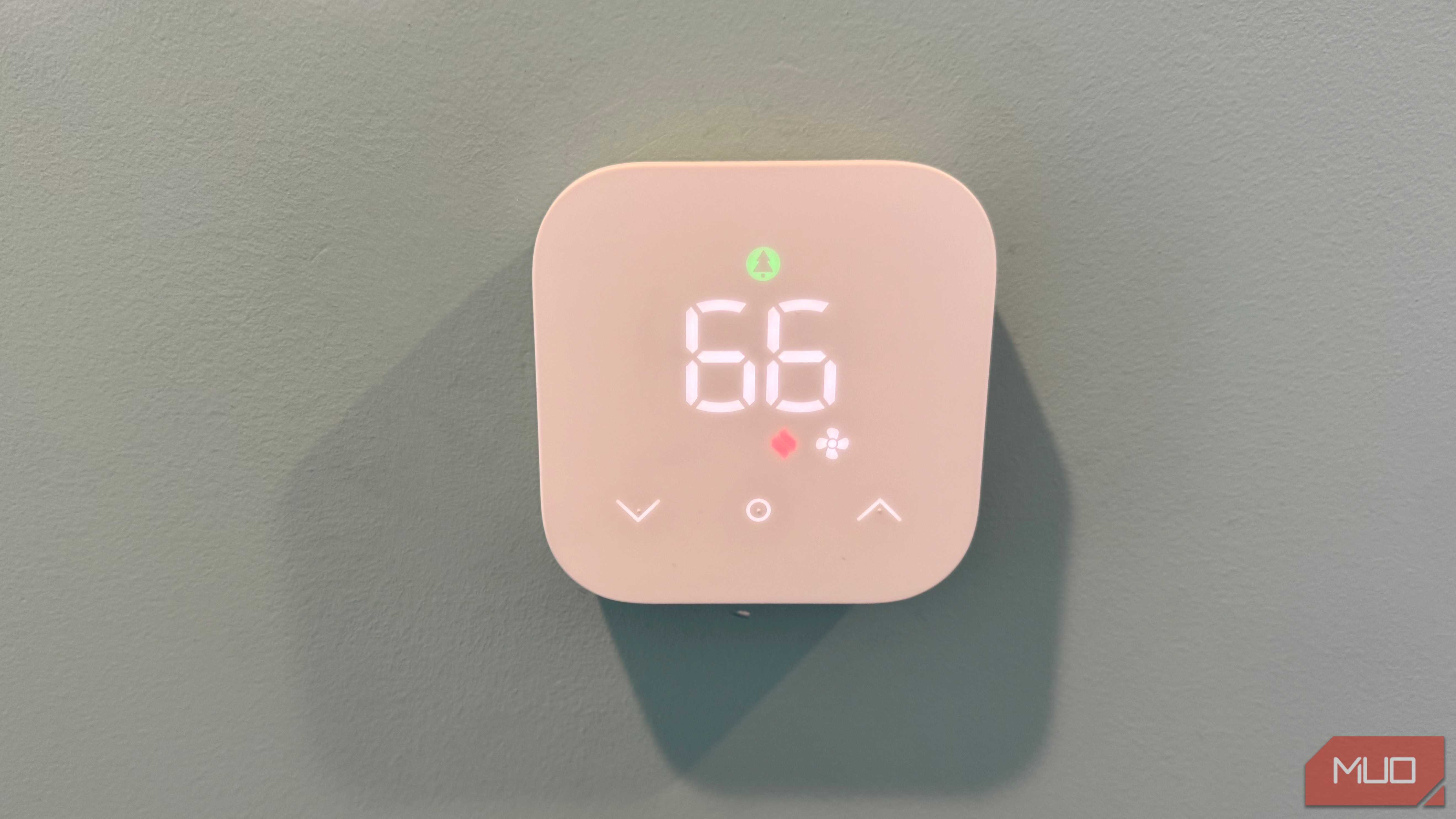 amazon smart thermostat on wall showing fan running