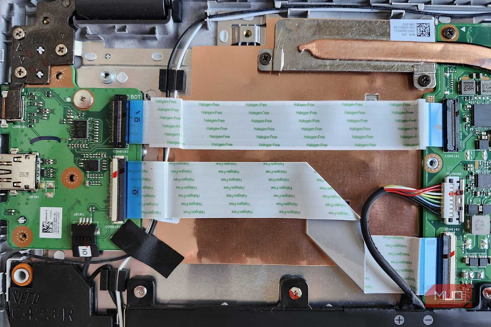 ASUS Chromebook insides, shwoing ribbon cables and the battery connector