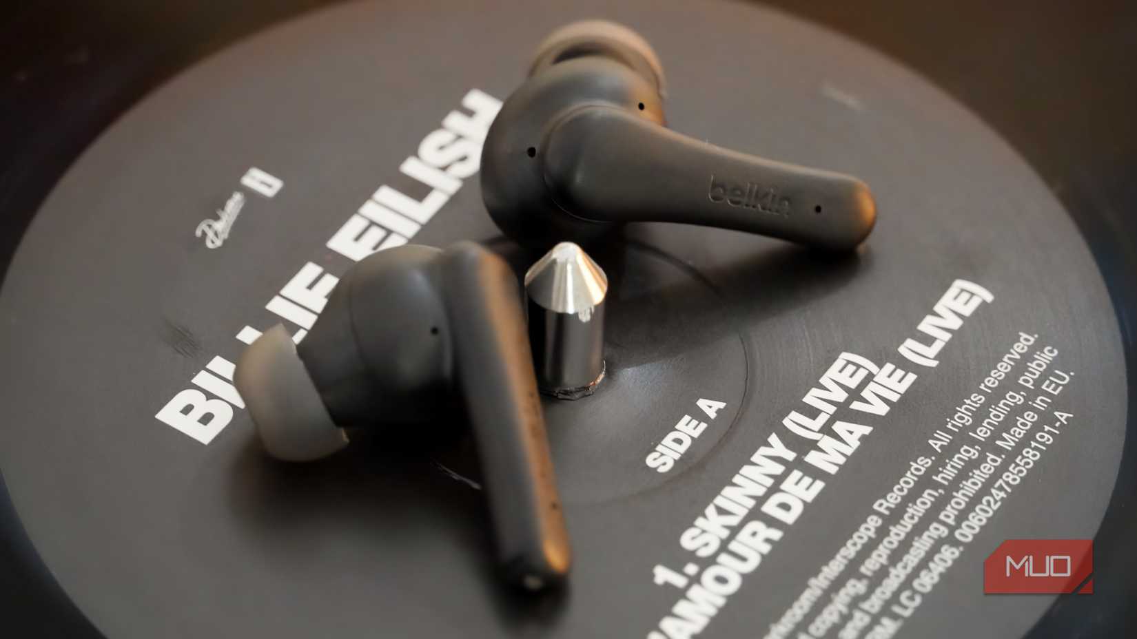 The Belkin SoundForm Rhythm ANC on top of a record label.