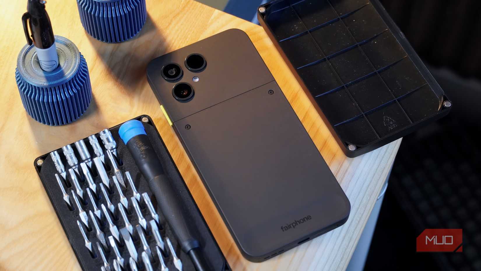 The Fairphone 6 beside a mobile repair toolkit.
