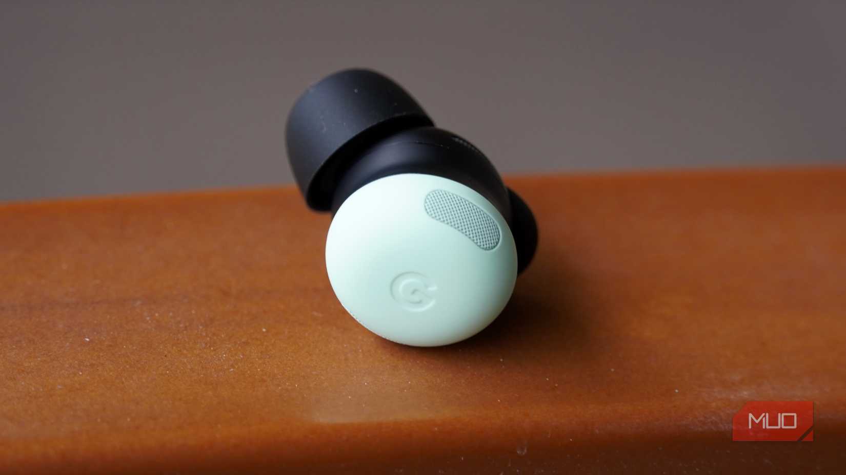 The front of a green Pixel Buds Pro 2 earbud.