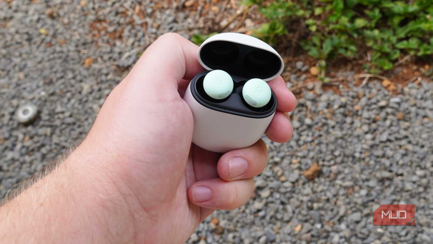 Google Pixel Buds Pro 2 with the case opened in the hand.