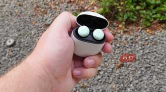 Google Pixel Buds Pro 2 with the case opened in the hand.