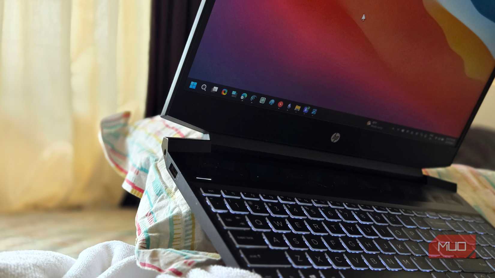 HP pavillion gaming laptop rested on a pillow