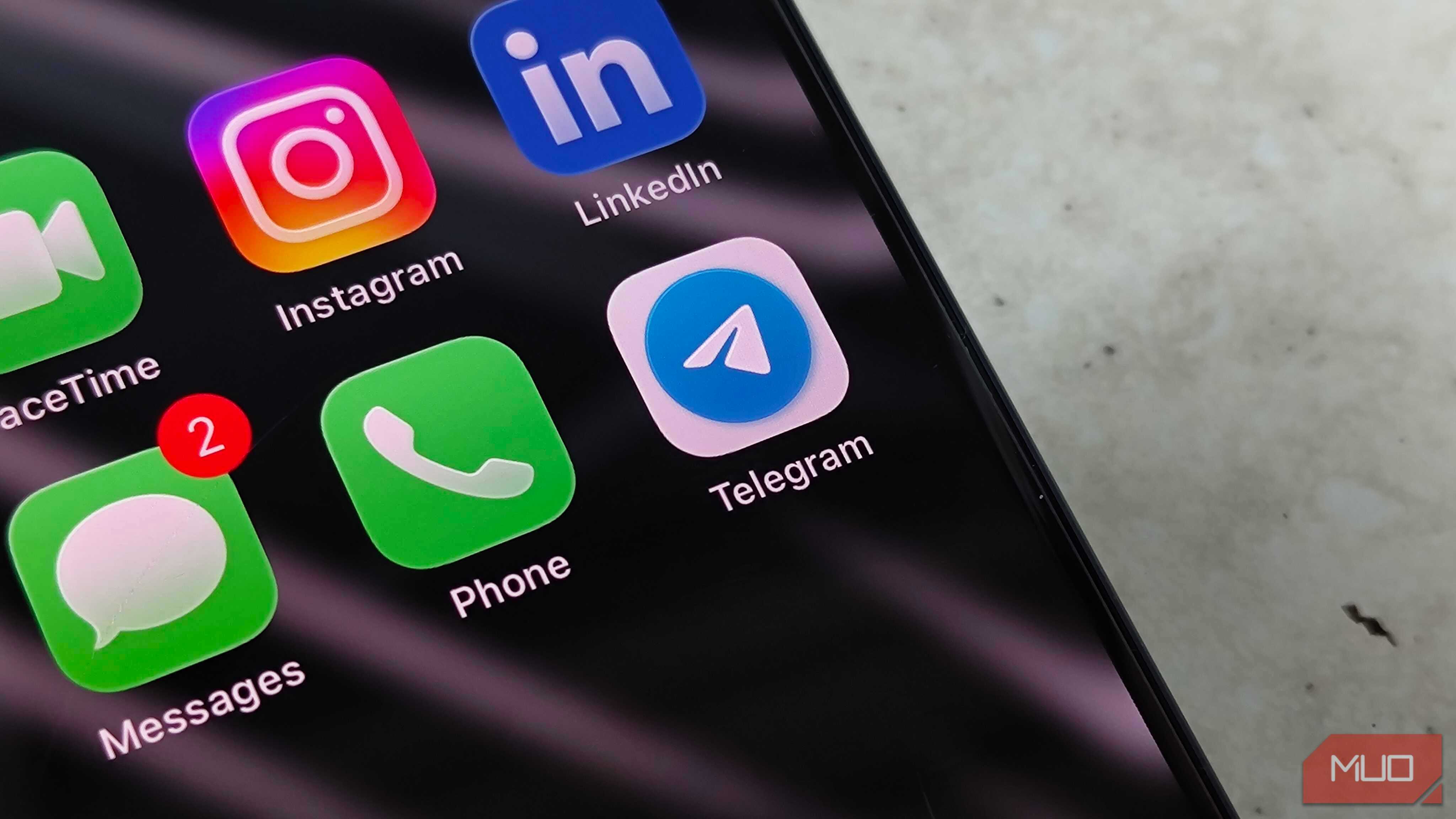 The Telegram app icon in a folder with other messaging apps on iOS