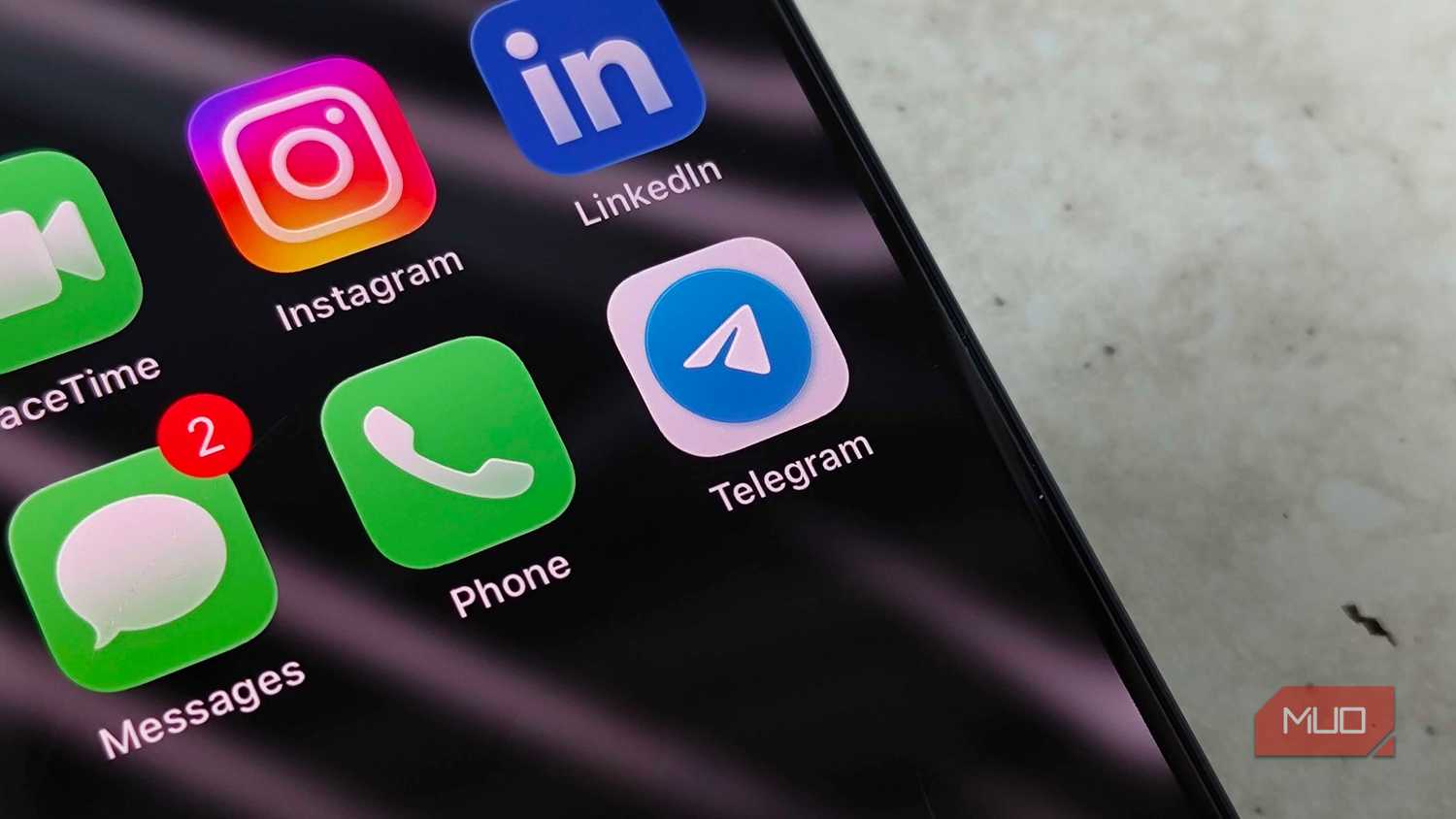 The Telegram app icon in a folder with other messaging apps on iOS