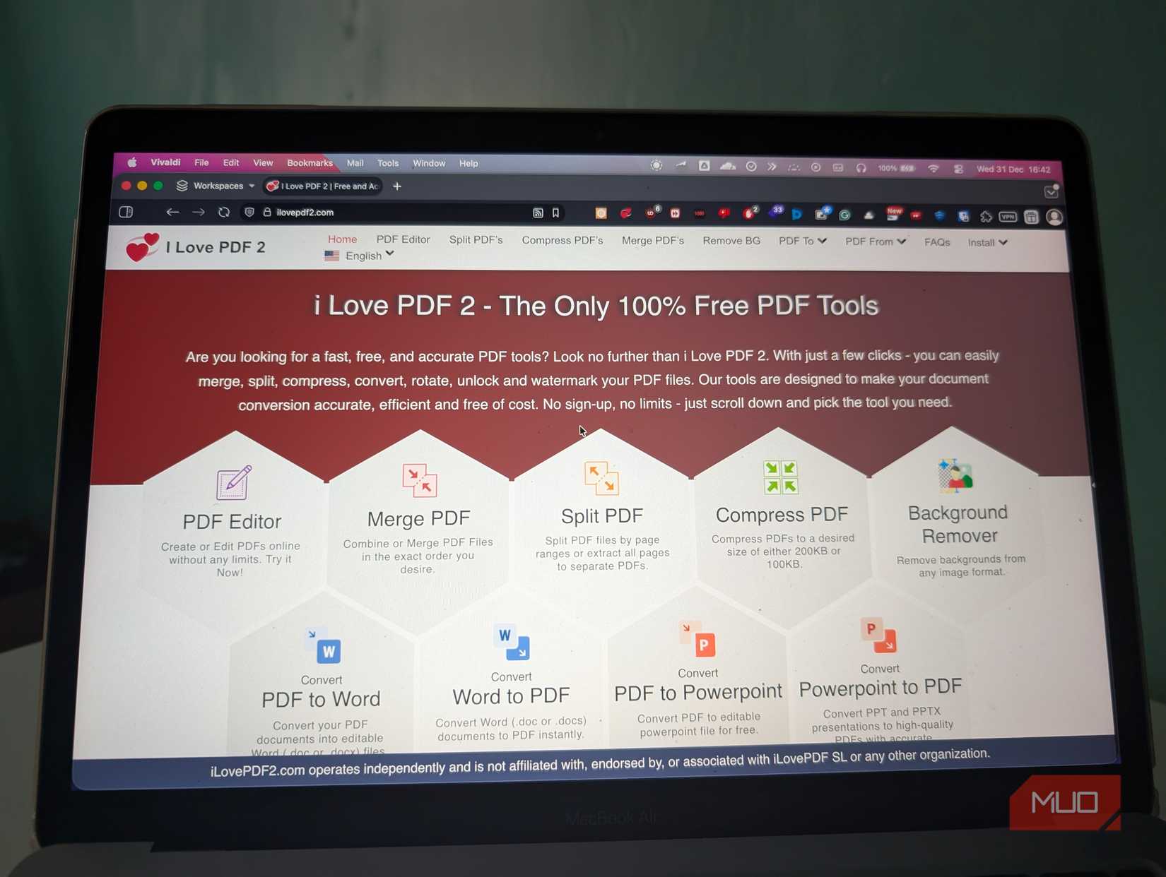 Laptop with browser open displaying I Love PDF 2 home page 